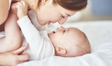 Woman playing with her baby